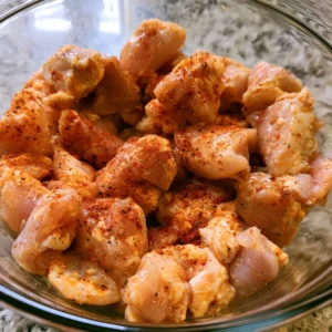 Chicken breast pieces seasoned with spices for high protein buffalo chicken mac and cheese