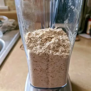 Rolled oats blended into fresh oat flour for high protein pumpkin muffins