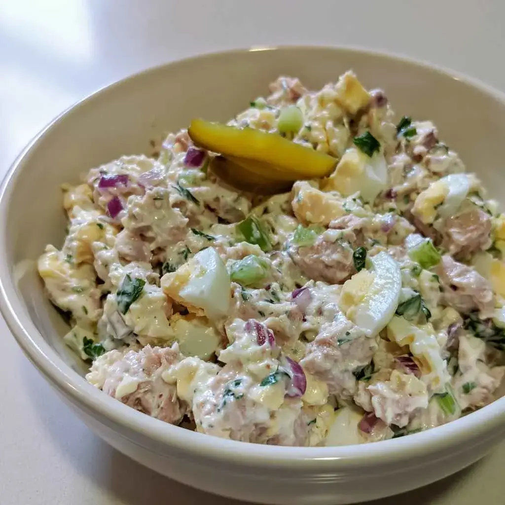 High protein tuna salad with no mayo in a bowl next to sourdough toast