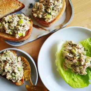 Finished high protein tuna salad served on sourdough toast and in a lettuce cup
